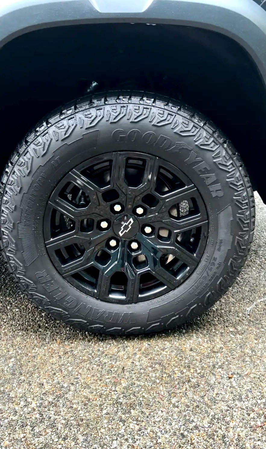 Clean black Chevy Colorado wheel and tire after detailing
