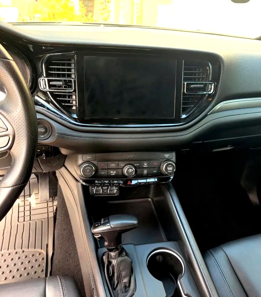 Clean dashboard, touchscreen and center console after an interior detail
