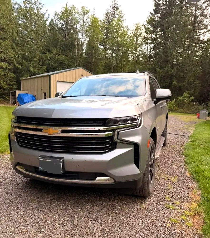 Clean silver Chevy Tahoe from the front three-quarter angle